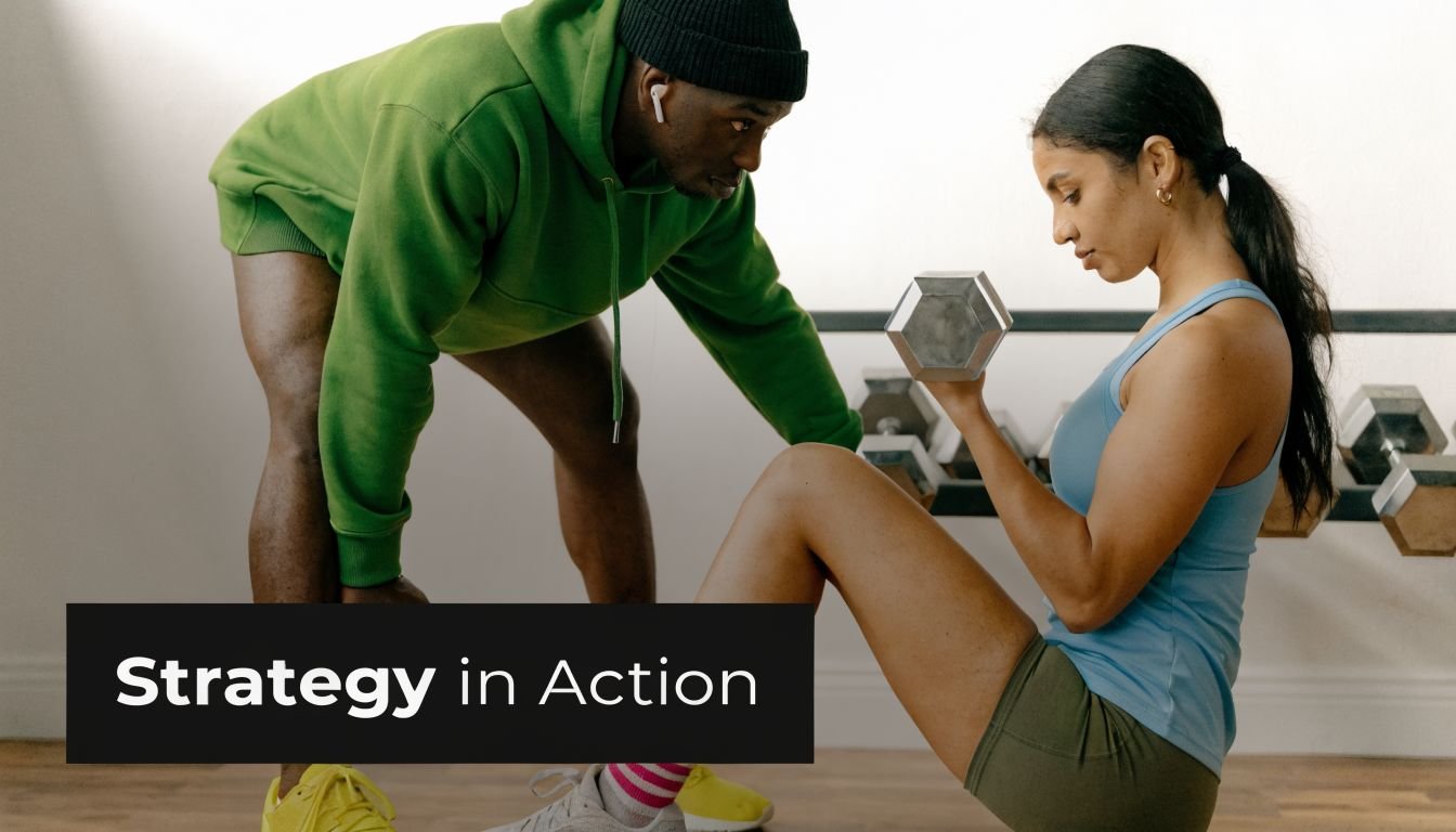 A fitness trainer coaching a woman during a bicep curl exercise in a studio setting.